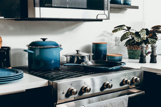 Modern kitchen setup symbolizing 2025 kitchen utensils like the oil spray bottle and infrared thermometer.